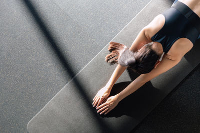Low section of woman sitting on floor