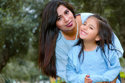 Portrait of happy mother and daughter