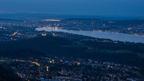 High angle view of illuminated buildings in city at night