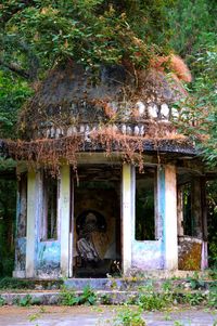 Built structure with trees in foreground