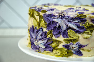 High angle view of purple flowers in plate on table