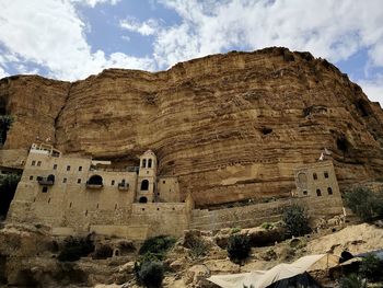 View of old ruins against cloudy sky