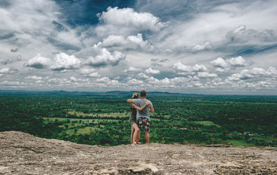 Full length of man standing on land against sky