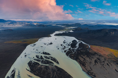 Aerial view of snowcapped mountains against sky