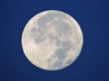 Low angle view of moon against sky at night