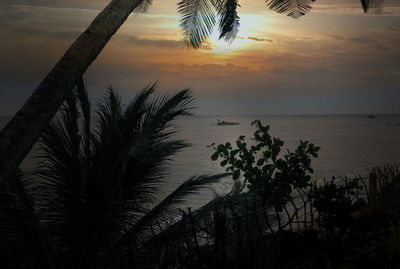 Scenic view of sea against sky at sunset