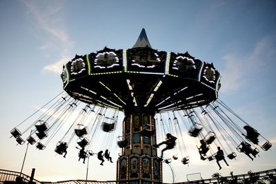 Low angle view of ferris wheel against sky