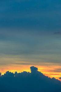 Scenic view of silhouette mountains against sky during sunset