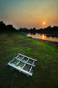 Scenic view of field against sky during sunset