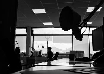 Silhouette lamp over table in office