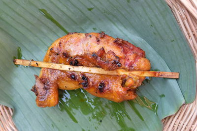 High angle view of meat on barbecue grill
