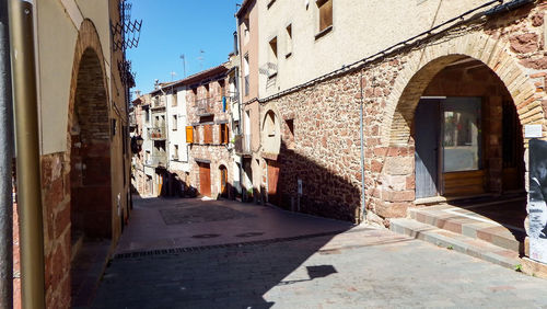 Narrow alley amidst buildings in city