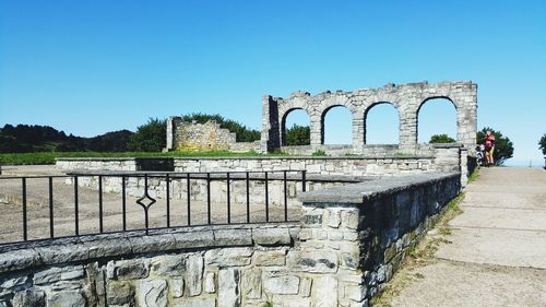 Old ruins against clear blue sky