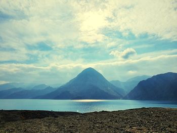 Scenic view of lake and mountains against sky