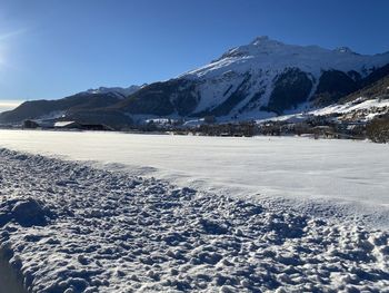 Scenic view of snowcapped mountains against sky