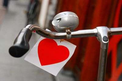 Close-up of red hanging outdoors on bike