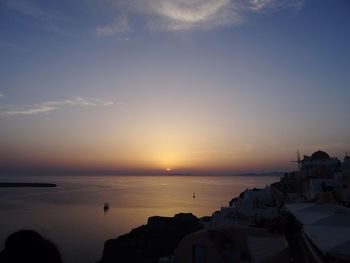 High angle shot of townscape against calm sea