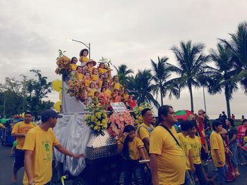 People on street against sky