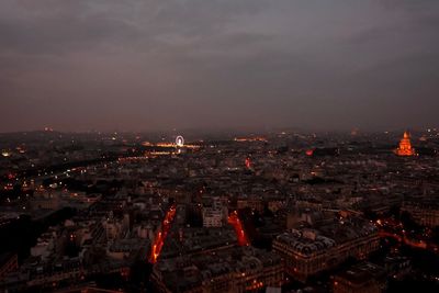 Aerial view of city lit up at night