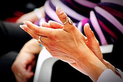 Close-up of woman hand holding flower