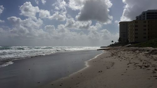 Scenic view of sea against cloudy sky