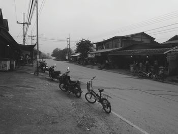 Bicycles against sky in city