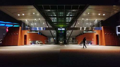 Man in illuminated room