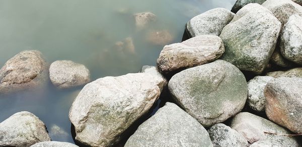 High angle view of stones on beach