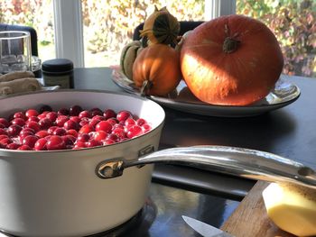 Close-up of fruits in container on table