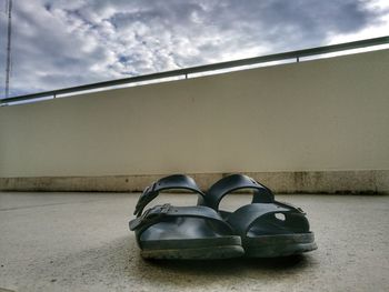 Close-up of shoes on wall