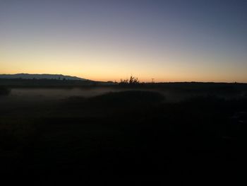 Scenic view of silhouette landscape against clear sky