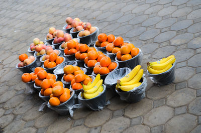 High angle view of orange fruits in container