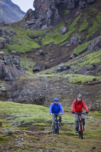 Two friends riding their mountain bikes around lake thingvellir