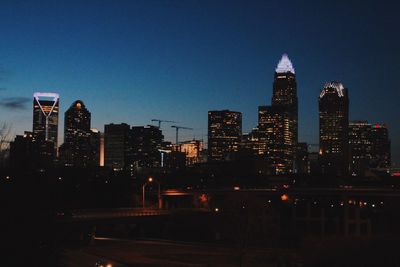 View of skyscrapers lit up at night