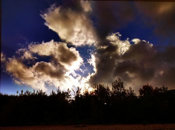 Scenic view of landscape against cloudy sky