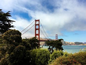 Golden gate bridge over sea against sky