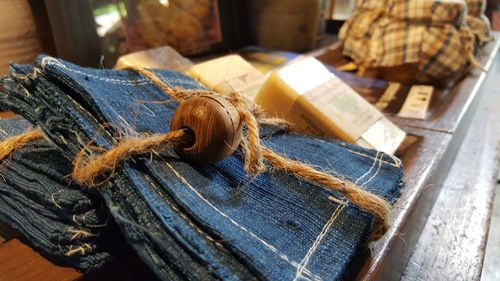 High angle view of denim pieces on table in store