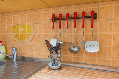 Kitchen utensils hanging on the kitchen wall