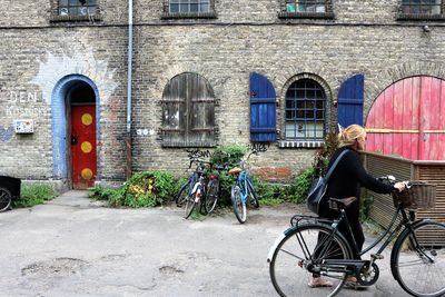 Bicycle against building in city