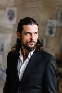 Close-up of well-dressed man looking away