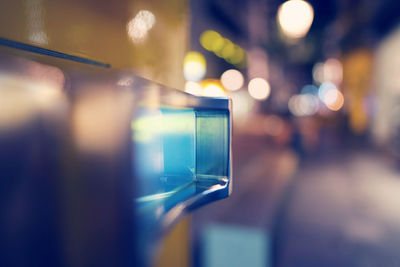 Close-up of illuminated lights on glass