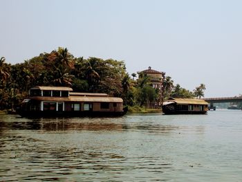 Alleppey houseboats kerala built structure by river against clear sky