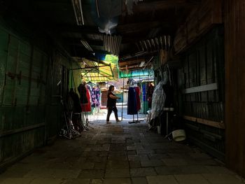 Woman walking at street market of clothes