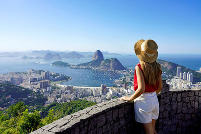 Rear view of woman standing in rio de janeiro, brazil