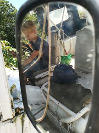 Rear view of boy holding ice cream