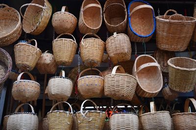Low angle view of wicker baskets for sale at market