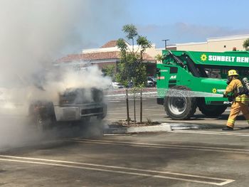 People working on street in city