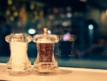 Close-up of glass jar on table