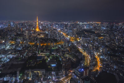 High angle view of city lit up at night