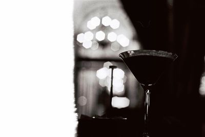 Close-up of wine glasses on table